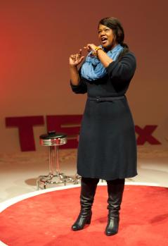 Valaida presenting during TEDxCLT 2013, photography by Deborah Triplett